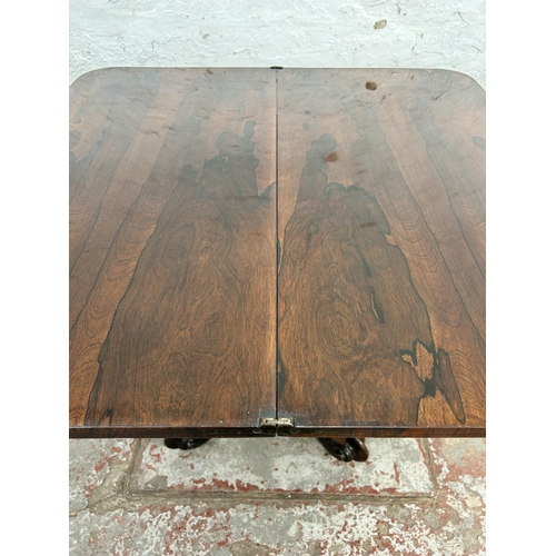 127 - A William IV rosewood fold over tea table on quatrefoil base