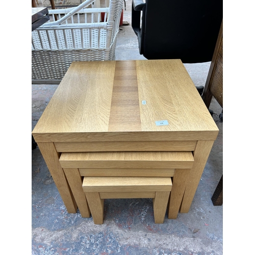 128 - A modern oak nest of three tables