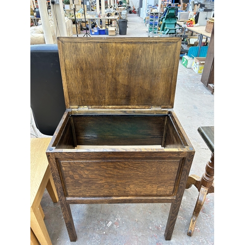 129 - A mid 20th century oak chest on stand