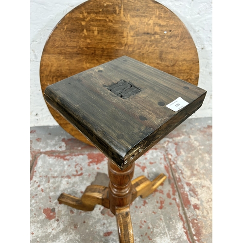 130 - A Georgian oak circular occasional table on tripod pedestal support