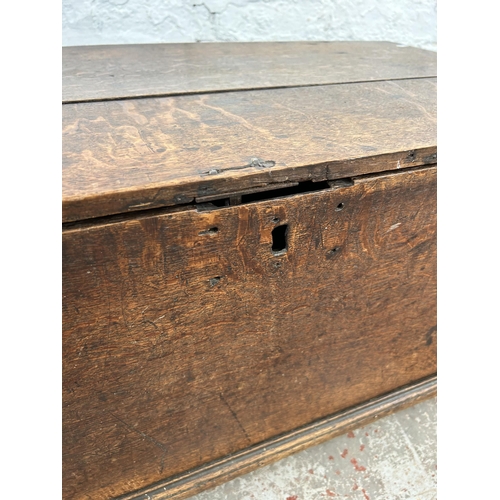 135 - A 19th century oak blanket box with later added castors