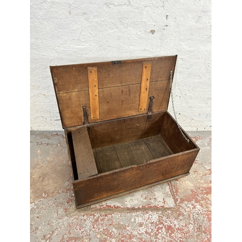 135 - A 19th century oak blanket box with later added castors