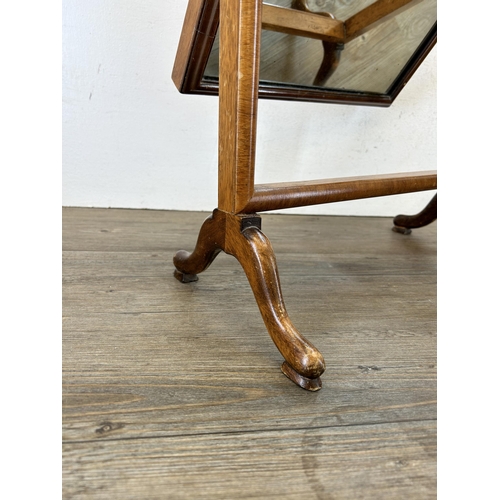 139 - A 19th century style burr walnut dressing table mirror