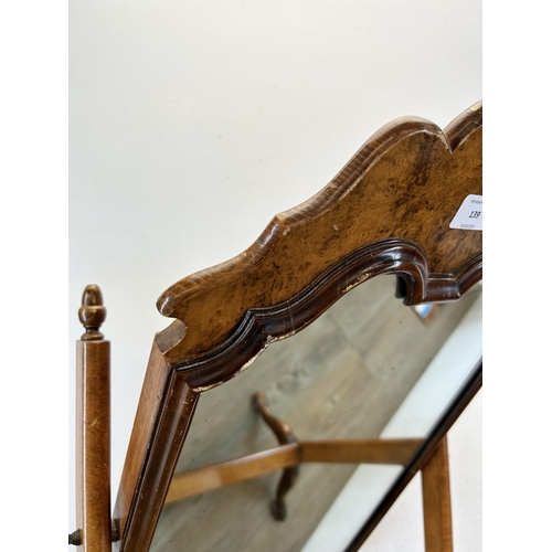 139 - A 19th century style burr walnut dressing table mirror