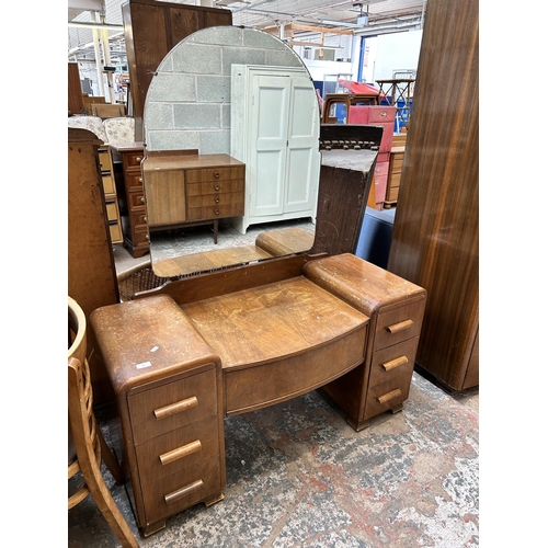 23 - An Austinsuite walnut three piece bedroom suite comprising two double wardrobes and dressing table