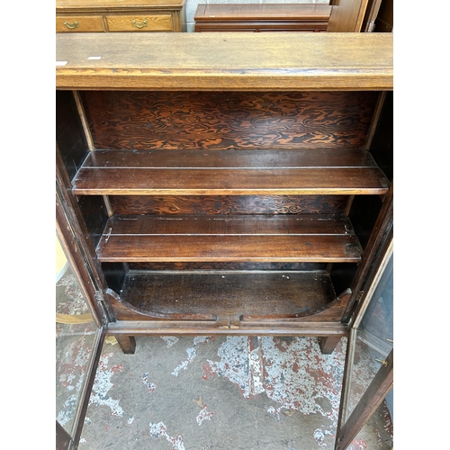 28 - An Art Deco oak bookcase with two glazed doors