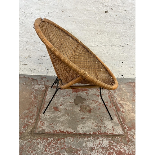 31 - A mid 20th century wicker and black tubular metal tub chair