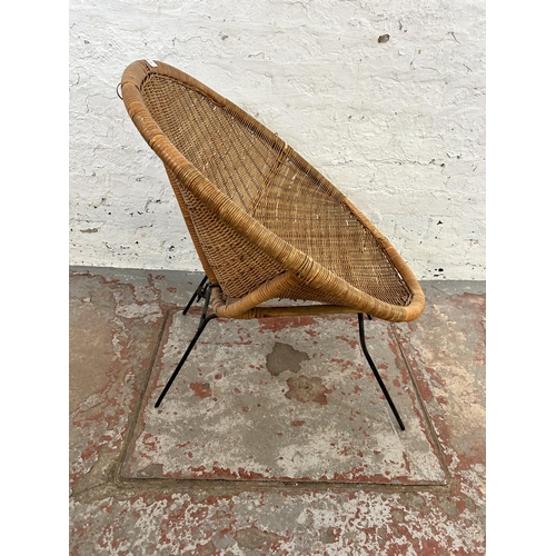 31 - A mid 20th century wicker and black tubular metal tub chair