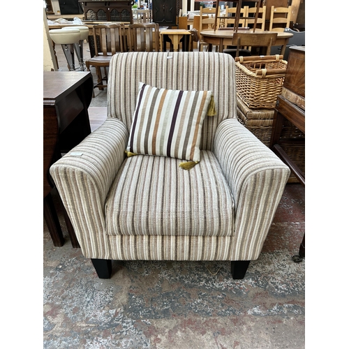 42 - A modern fabric upholstered armchair