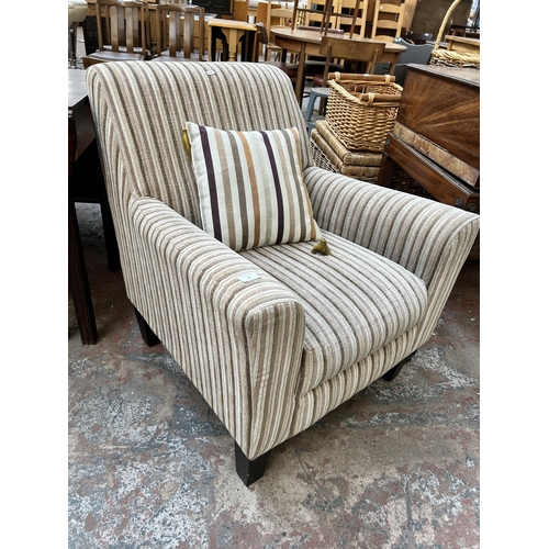 42 - A modern fabric upholstered armchair