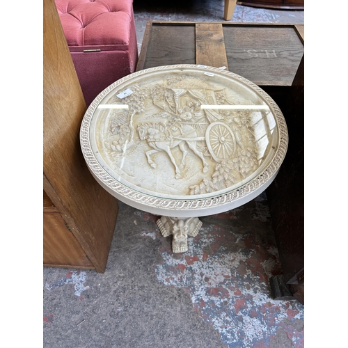 58 - An Oriental ivory effect resin circular side table with glass insert