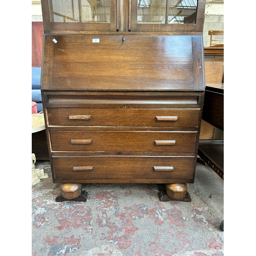 59 - A 1930s oak bureau bookcase