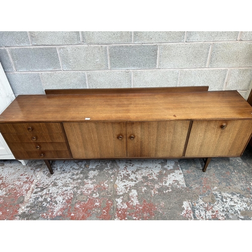 6 - A 1960s Meredew teak sideboard with four outer drawers, two cupboard doors and fall front