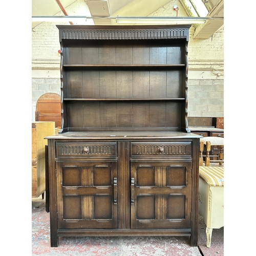 63 - A Priory style oak dresser