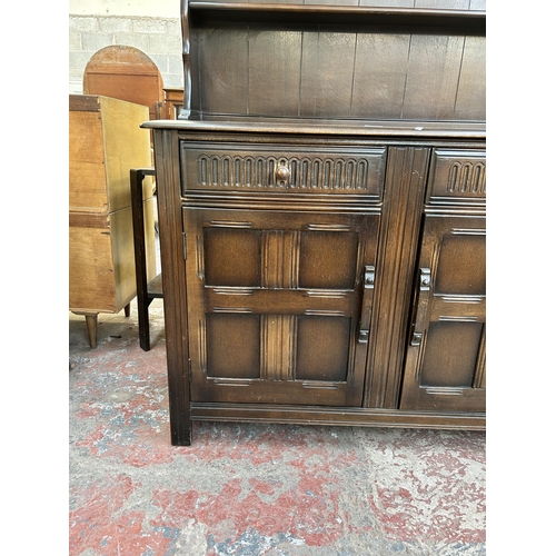 63 - A Priory style oak dresser