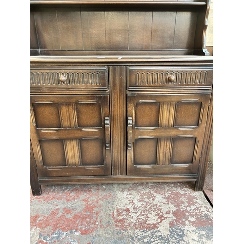 63 - A Priory style oak dresser