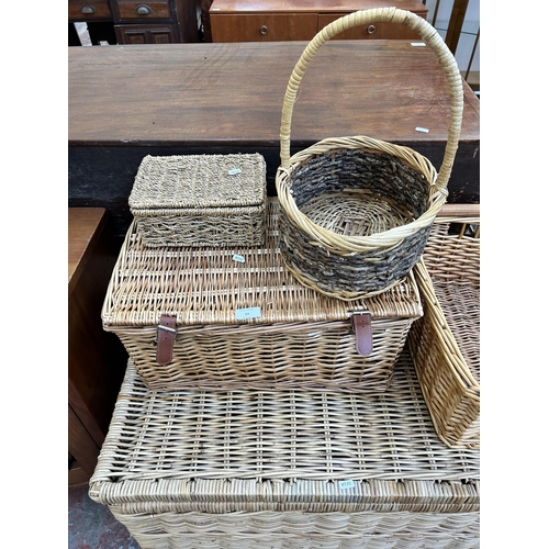 65 - Five pieces of wicker furniture, four baskets and one blanket chest