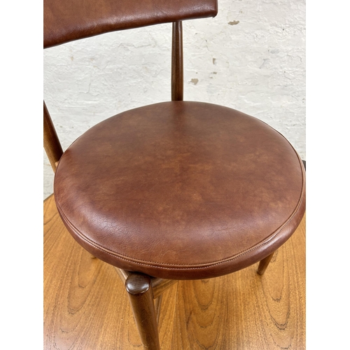 70 - A 1960s G Plan Fresco teak circular extending dining table and four dining chairs