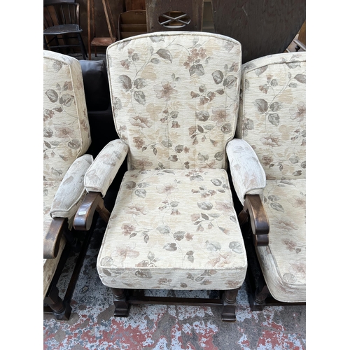 73 - An oak and floral upholstered three piece cottage lounge suite comprising three seater sofa and two ... 