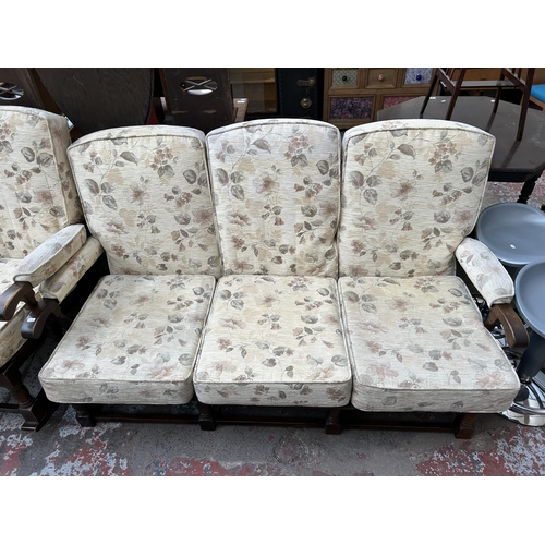 73 - An oak and floral upholstered three piece cottage lounge suite comprising three seater sofa and two ... 