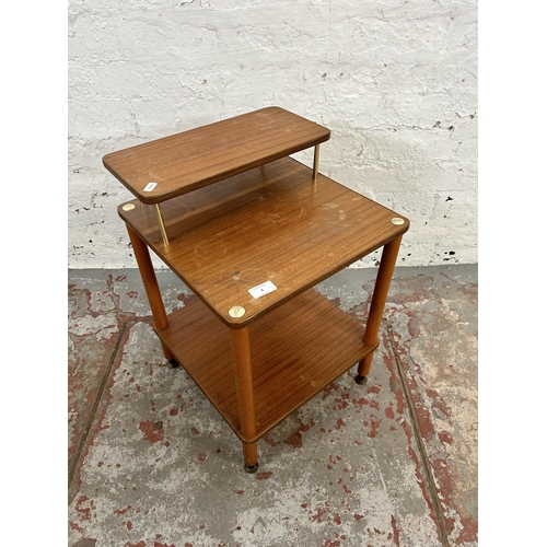 8 - A mid 20th century teak two tier side table