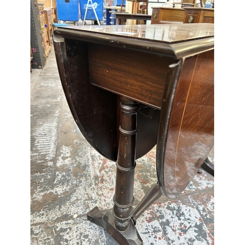 86 - A mahogany drop leaf Sutherland table