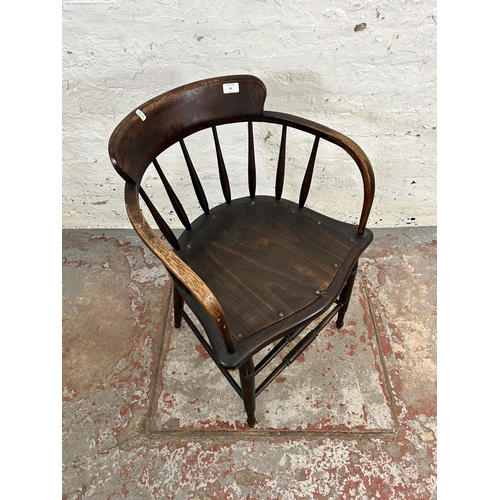 93 - An early/mid 20th century oak and beech captain's desk chair