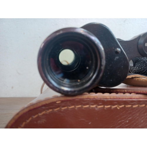 510 - A cased pair of Carl Zeiss Jenoptem 8 x 30w binoculars