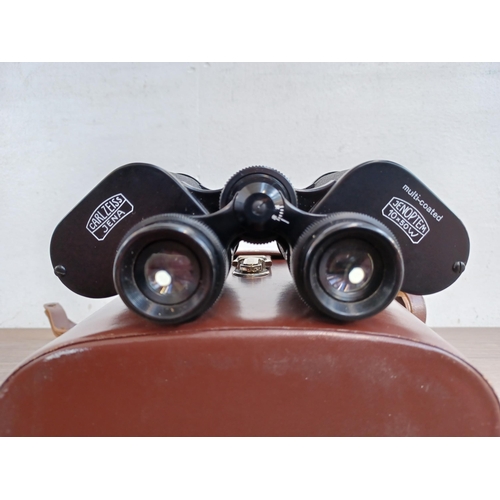 512 - A cased pair of Carl Zeiss Jenoptem 10 x 50w binoculars