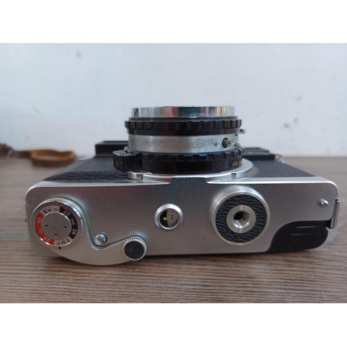 513 - A cased 1960s Fuji Fujica 35-EE auto/semi/manual exposure 35mm rangefinder camera fitted with Fujino... 