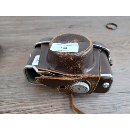 513 - A cased 1960s Fuji Fujica 35-EE auto/semi/manual exposure 35mm rangefinder camera fitted with Fujino... 