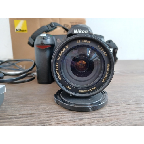 517 - A boxed and cased Nikon D50 digital SLR camera fitted with Quantaray 28-200mm 1:3.5-5.6 lens with so... 