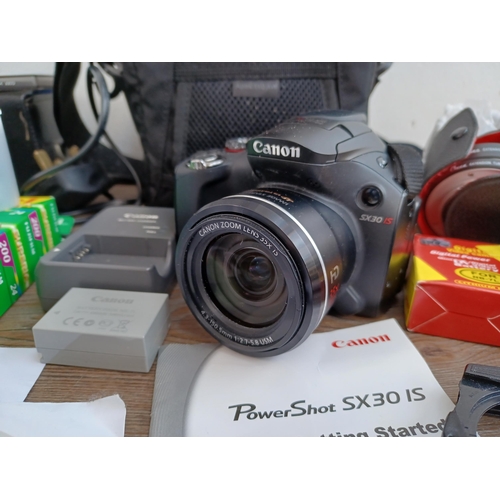 518 - A collection of photography equipment to include Canon EOS 500N 35mm SLR camera fitted with Sigma 28... 