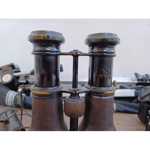 518A - Four items, one pair of early 20th century French Colmont binoculars marked broad arrow S.3 M.4342, ... 