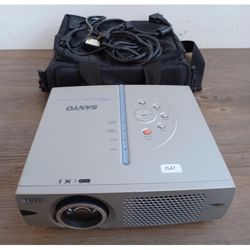 521 - A cased Sanyo PLC-XW20A Pro xtra X Multiverse projector with cables