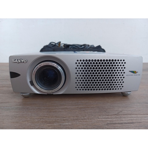 521 - A cased Sanyo PLC-XW20A Pro xtra X Multiverse projector with cables