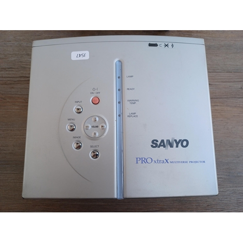 521 - A cased Sanyo PLC-XW20A Pro xtra X Multiverse projector with cables