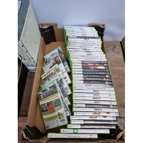 593 - Two boxes containing Microsoft Xbox 360 games, consoles and accessories