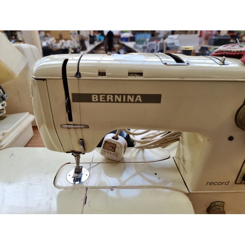 605 - A cased Bernina record 730 electric sewing machine with foot pedal