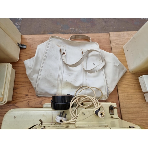 605 - A cased Bernina record 730 electric sewing machine with foot pedal