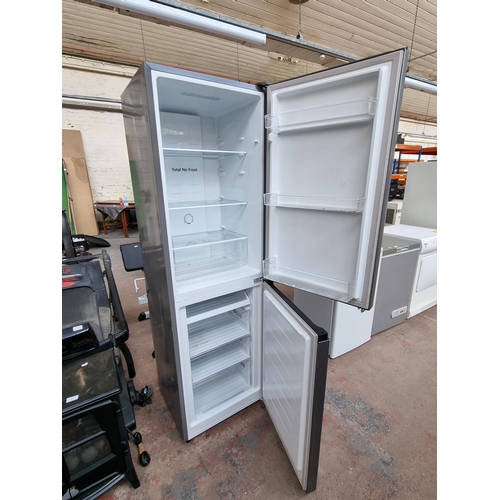 623 - A Fridgemaster upright fridge freezer approx. 179cm high