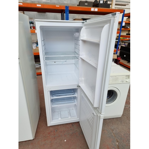 628 - An upright fridge freezer - approx. 149cm high