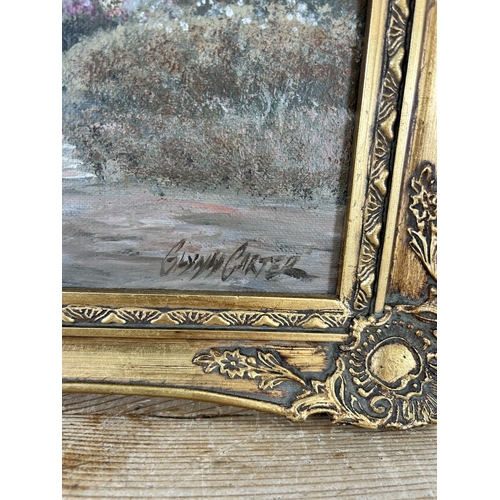 169 - A 20th century gilt framed oil on board of a cottage, signed Glynn Carter - approx. 39cm high x 50cm... 