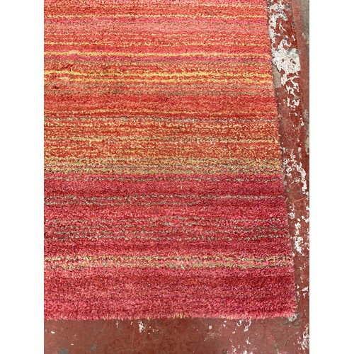 119 - A Next 100% pure new wool rug - approx. 171cm x 119cm