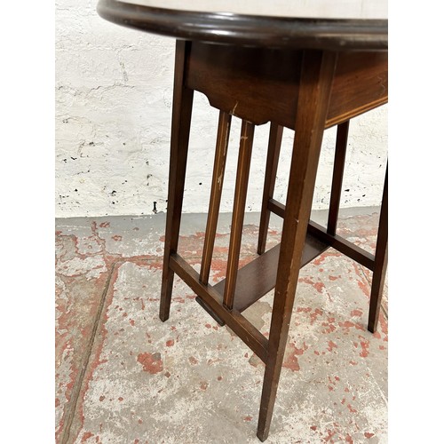 81 - An Edwardian inlaid mahogany circular top side table