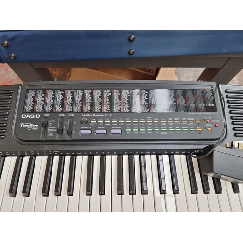 543 - A Casio CT-636 electronic keyboard with stand and power adaptor