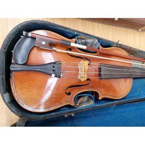 550 - A cased vintage ¾ size violin with bow