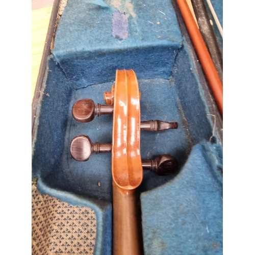 550 - A cased vintage ¾ size violin with bow