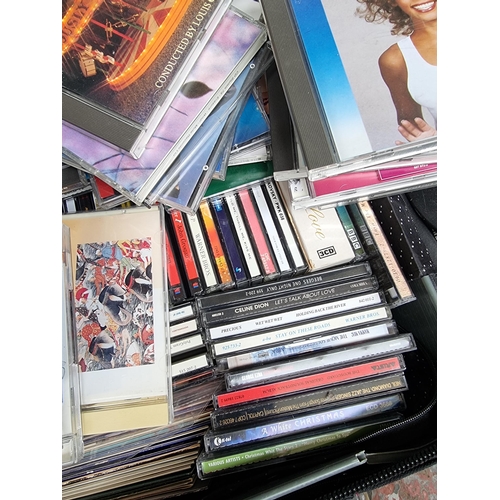 552 - A suitcase containing a collection of CDs