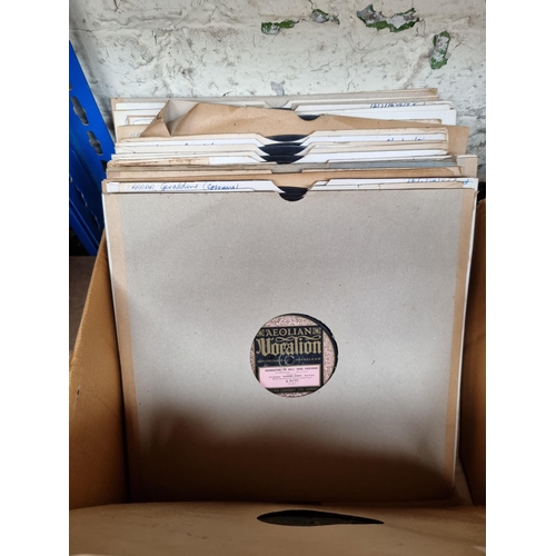 556 - A box containing a collection of shellac records